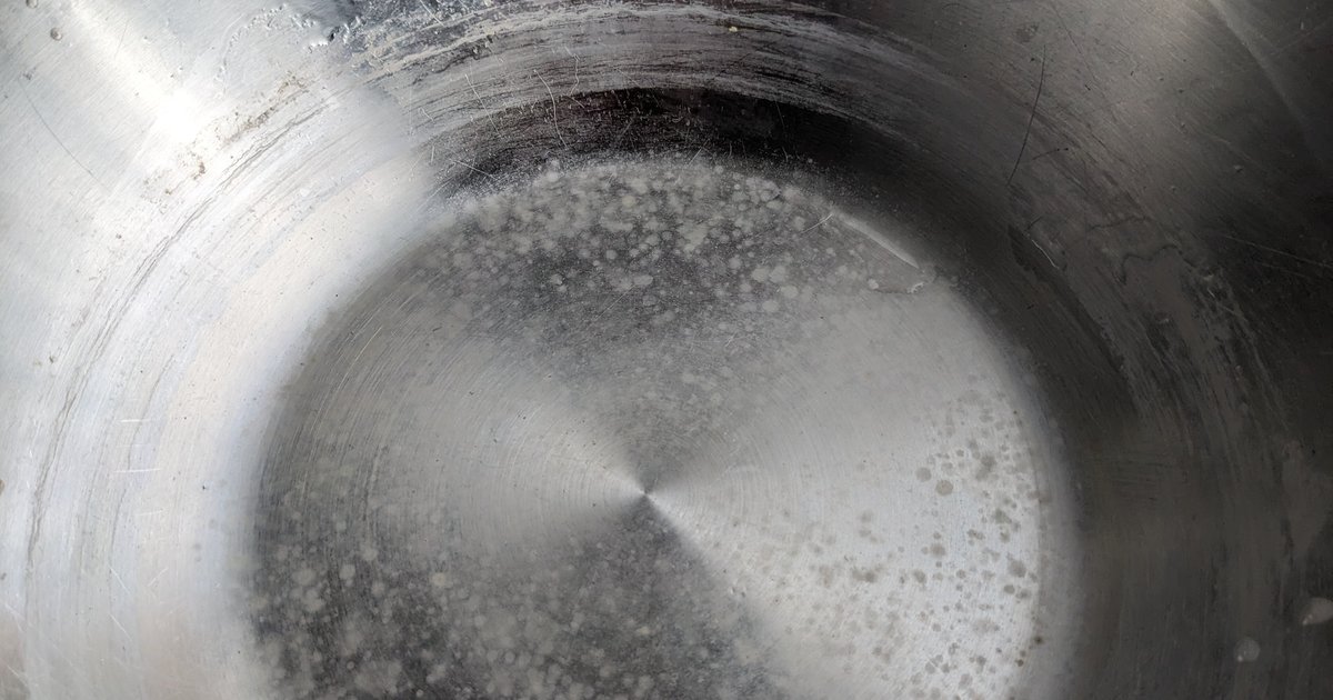 Limescale deposit on a cooking pot from hard water
