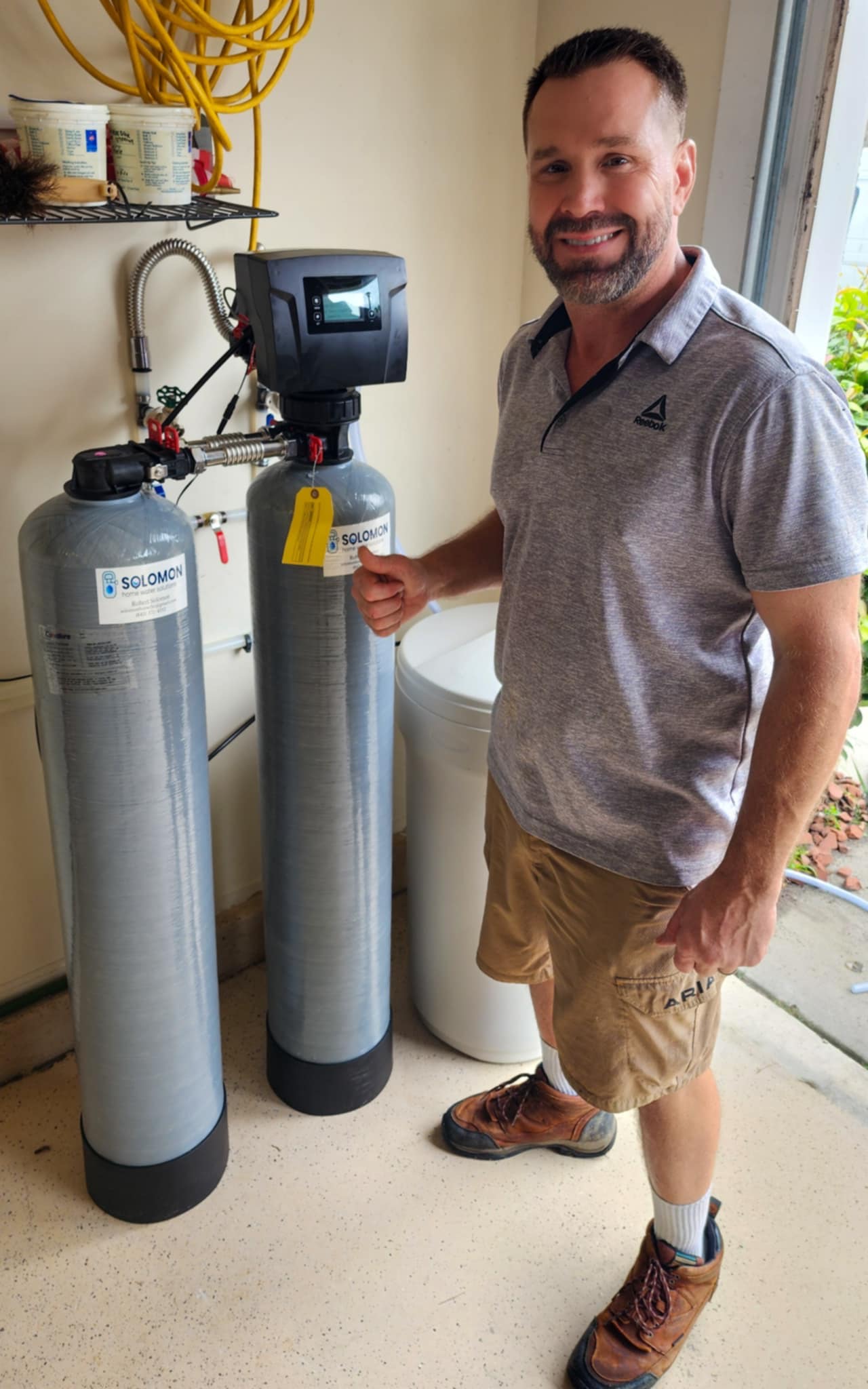 Robert Solomon with a completed water treatment installation